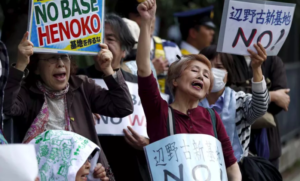 People protest the planned relocation of a US military base in Japan to Okinawa's Henoko coast on April 17, 2015. (Reuters / Issei Kato)